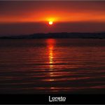 Foto: "Puesta de sol en la Playa do Terrón frente a Illa de Arousa" de Loreto  López Baltar