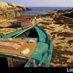 Foto: "Barca junto al Faro de a Illa de Arousa" de Loreto  López Baltar